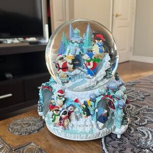 Kirkland Holiday musical snow Globe with Penguins and Bears on revolving base.